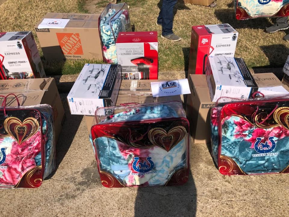 Humanitarian worker sorting through donated items for refugees